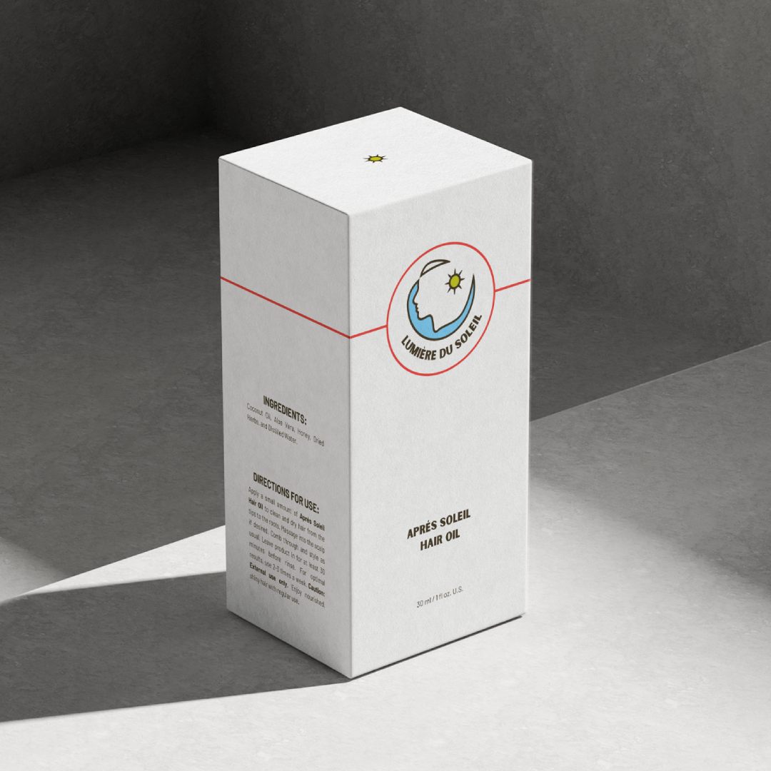 Packaging mockup of Lumière Du Soleil hair oil against a concrete background.